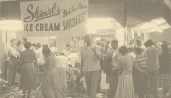 Group of people under Stewart's make your own sundae sign