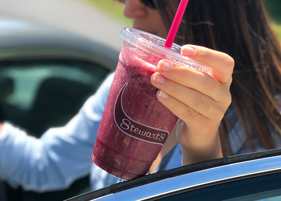 girl holding a smoothie