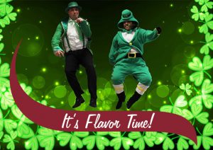 Two managers jumping wearing green